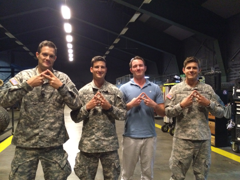 The actors of Enlisted throwing up the Terminal Lance hand signal.